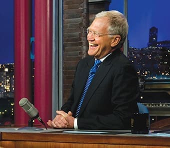 David Letterman laughs during a segment of his Late Show with David Letterman in 2011. He recently retired after 33 years as a late night TV talk show host on NBC and CBS. (U.S. Department of Defense photo by Chad J. McNeeley/Wikimedia Commons)